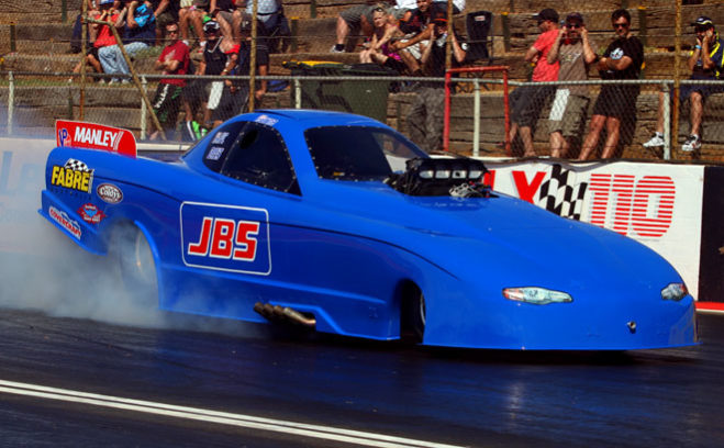 Wayne Newby confronted the scene of a dramatic crash in April 2012 to come back and win in Top Alcohol at the Aeroflow Summer Speedfest on Sunday. Ten months ago Newby was left with a written off race car following a 200kmh impact with the safety barriers, but this time he left with the ANDRA trophy and the first win since shifting into his new JBS Tools funny car.